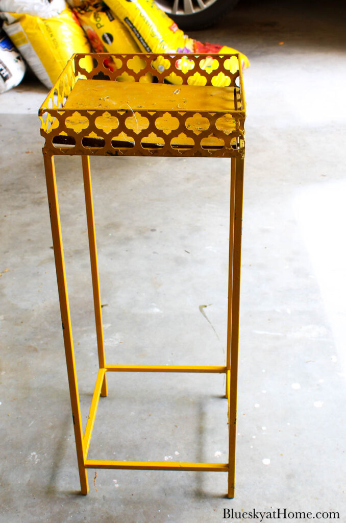 yellow metal stand