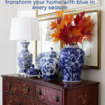 group of chinoiserie vases with autumn leaves on a antique chest graphic
