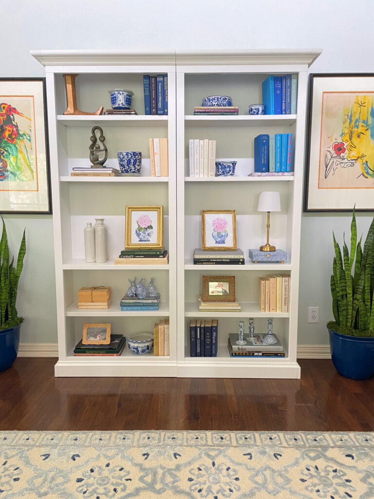 bookcase with blue books, chinoiserie and blue art