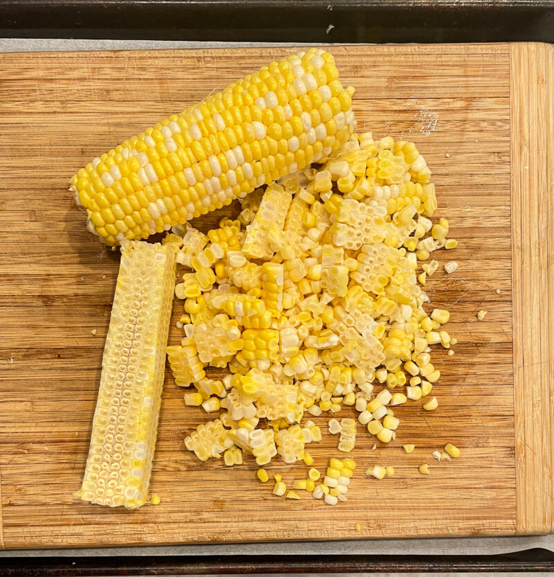 corn kernels off the cob on a cutting board