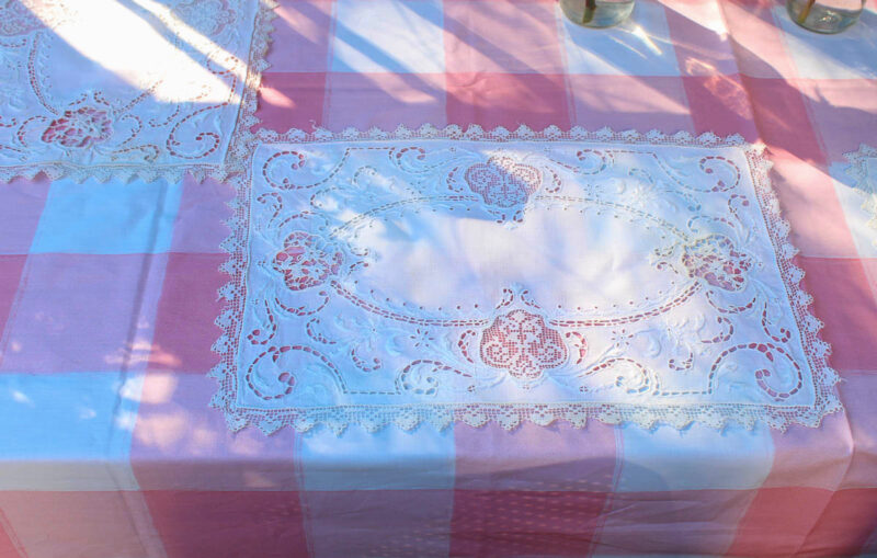 pink and white table cloth with white placemat
