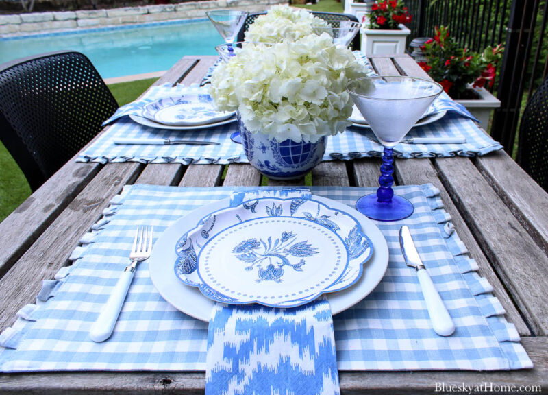 outdoor summer table place settings with flowers