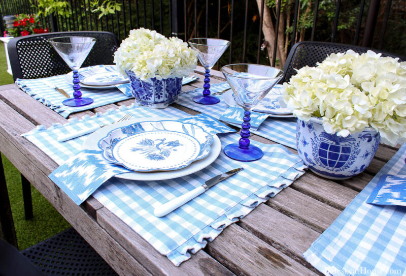outdoor summer table place settings with flowers