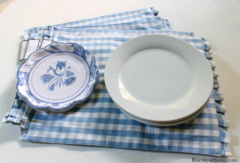 white plates and flower plates on placemats