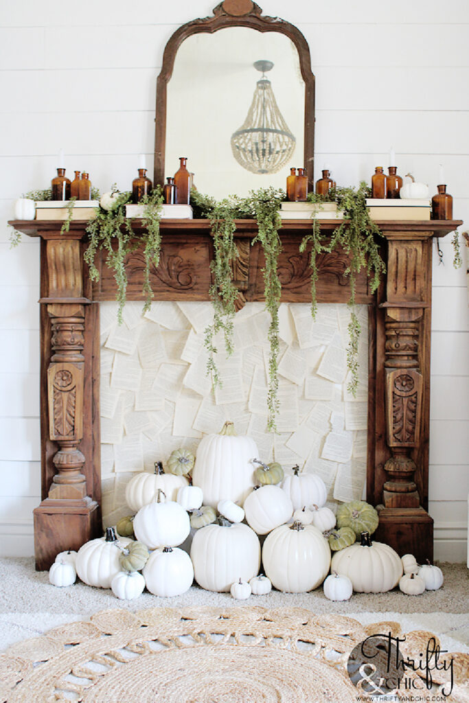 wood mantel with white pumpkins