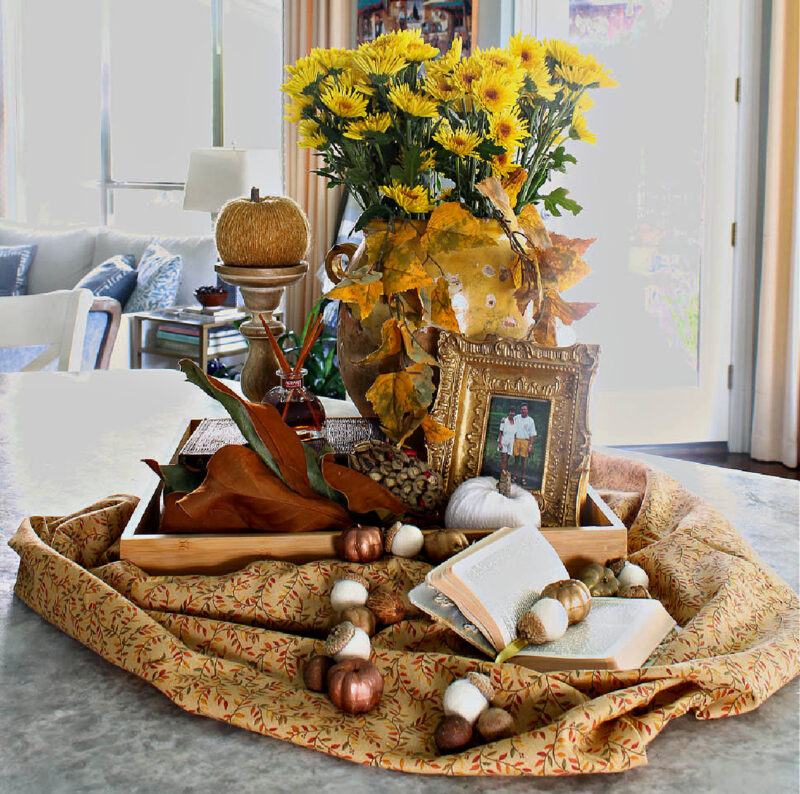 fall vignette with flowers and frames in a tray