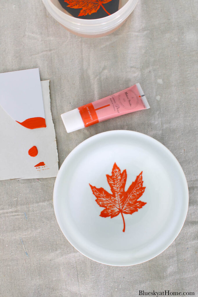 orange leaf on fall plate