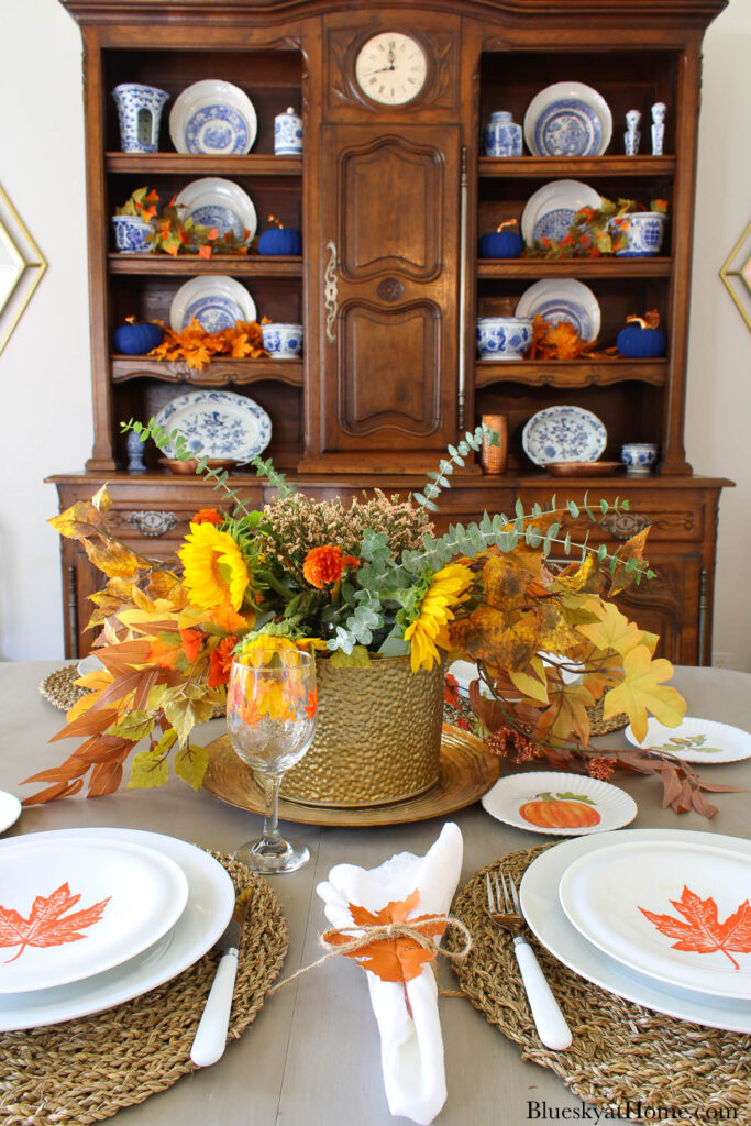 fall centerpiece with flowers and leaves