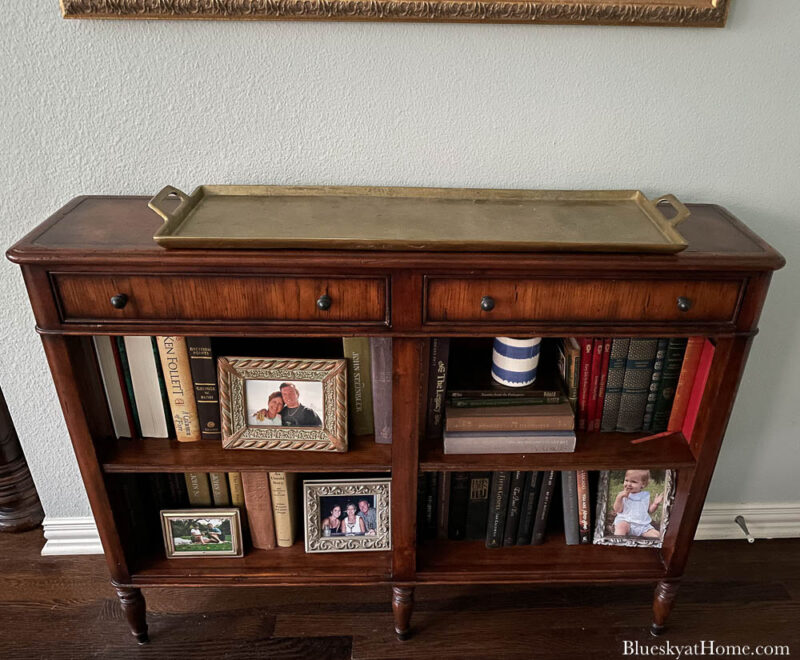 brass tray on console table