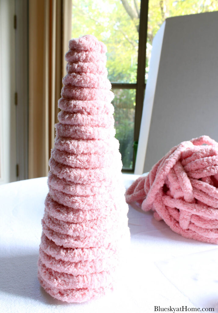 pink yarn on styrofoam cone