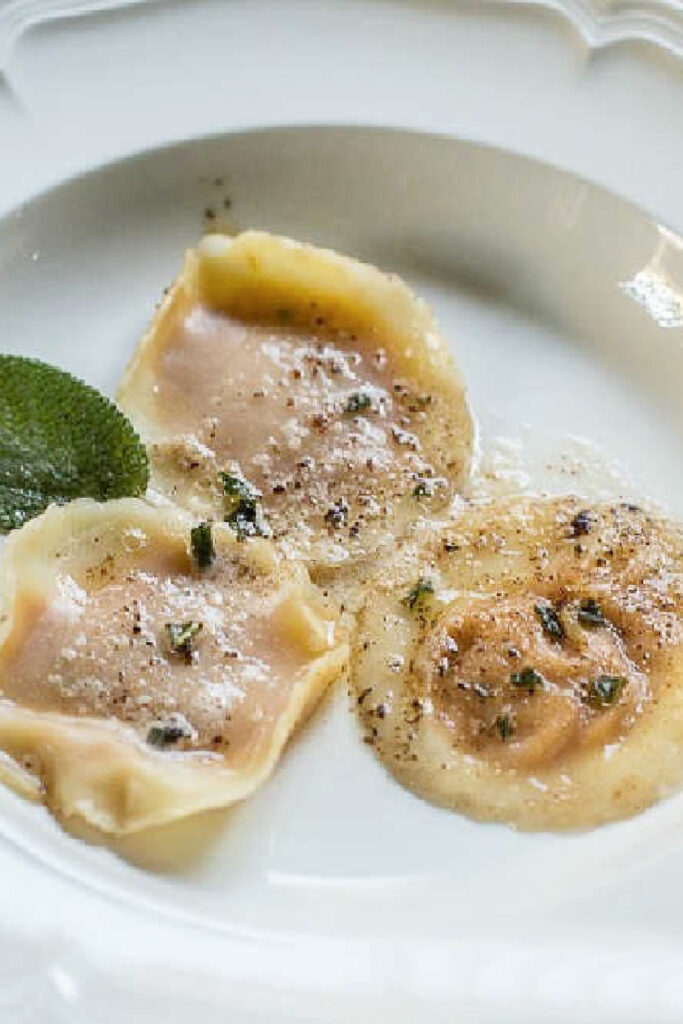 pumpkin ravioli on white place