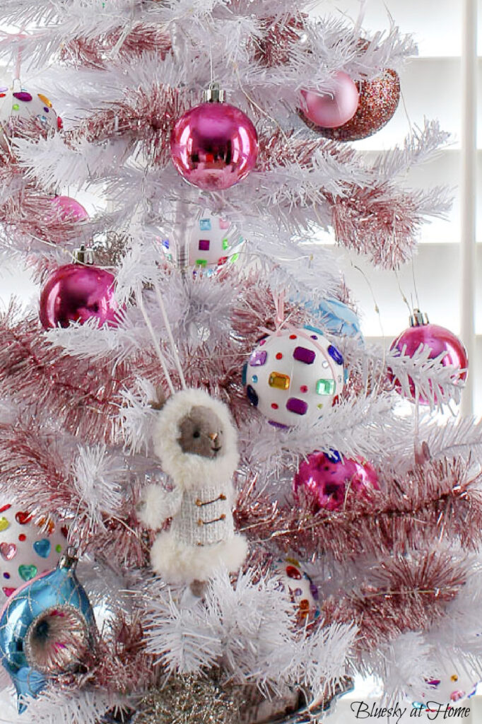 Christmas tree ornaments on white tree