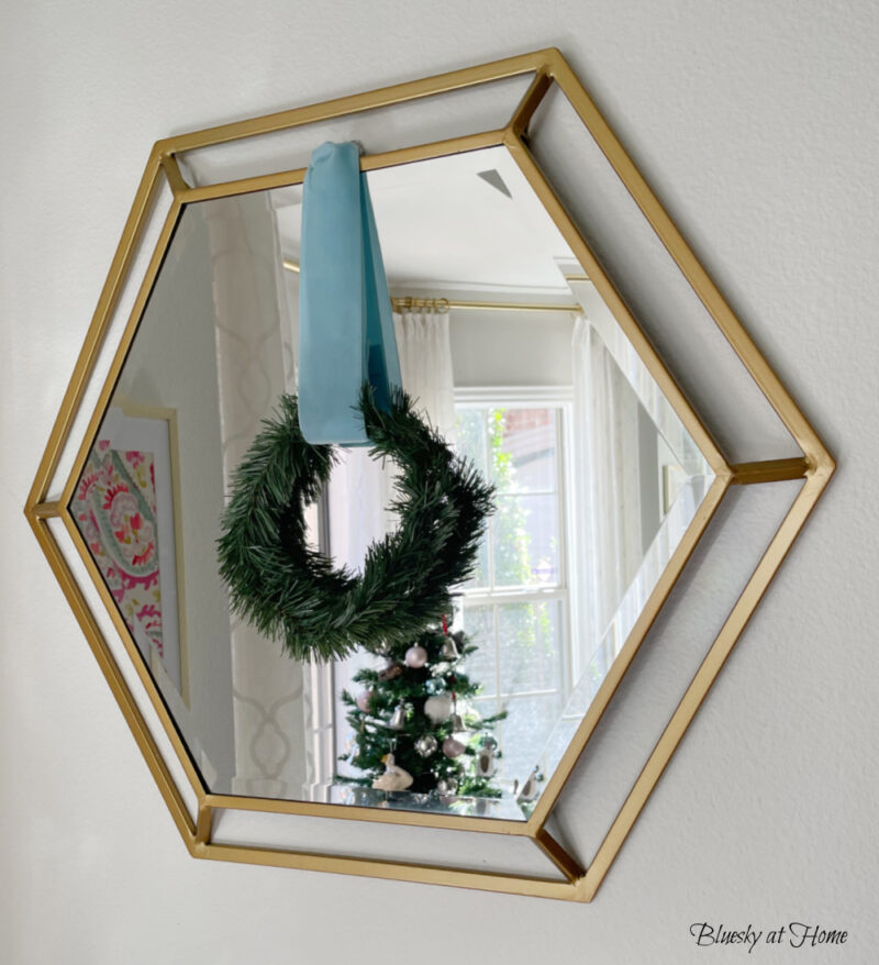 wreath of mirror with blue velvet ribbon