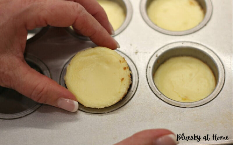 removing cherry cheesecake tartlets from pan