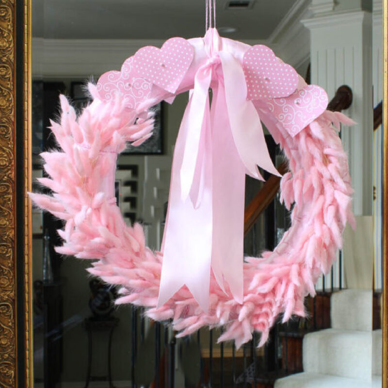 pink Valentine wreath made with rabbit tail grass, ribbon and paper hearts