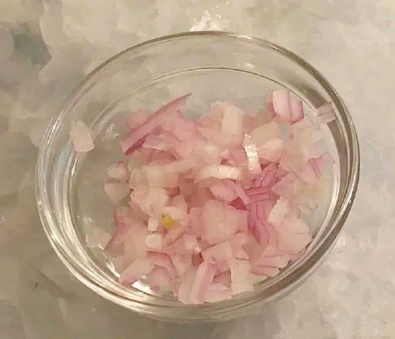 chopped shallots in clear glass bowls