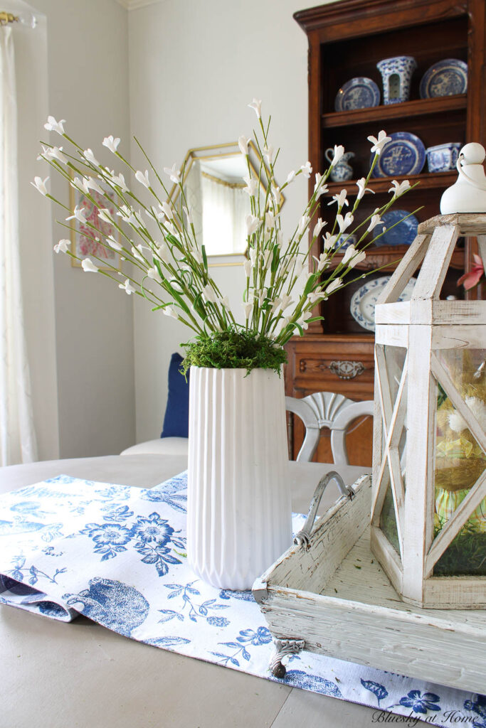 white vase with white flowers