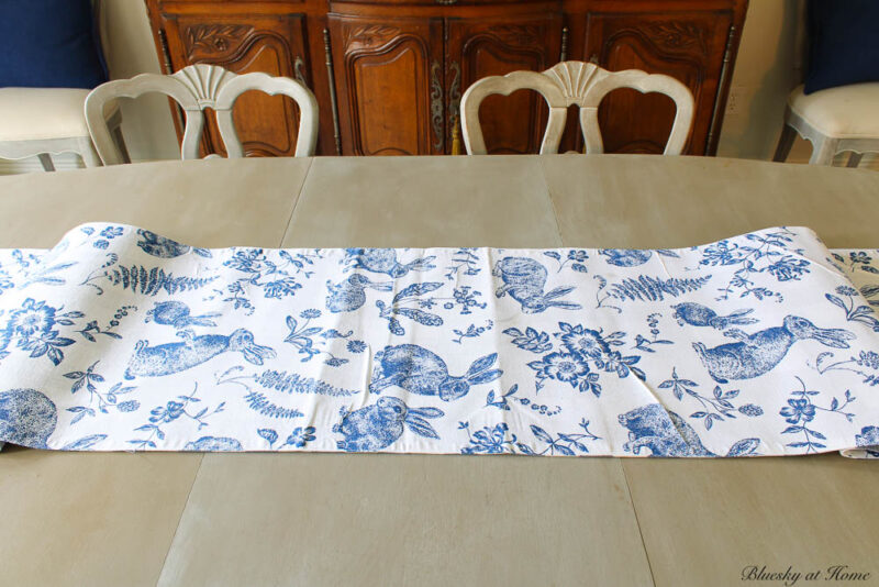 blue and white runner on dining table