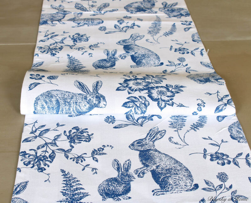 blue and white runner on dining table