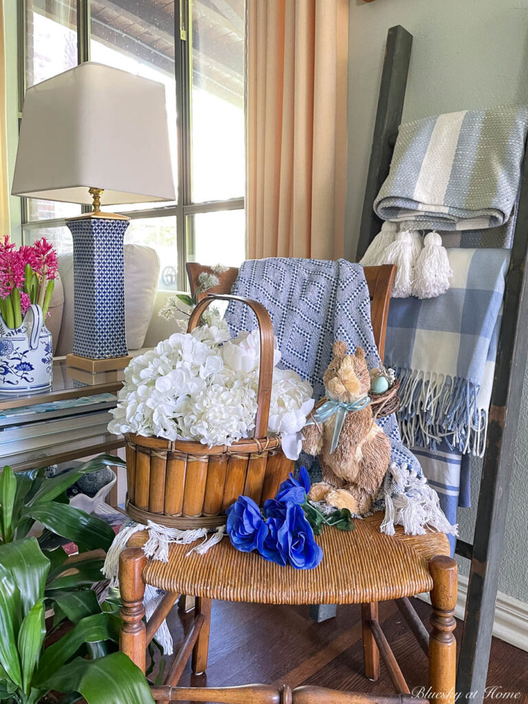 white flowers in basket with bunny