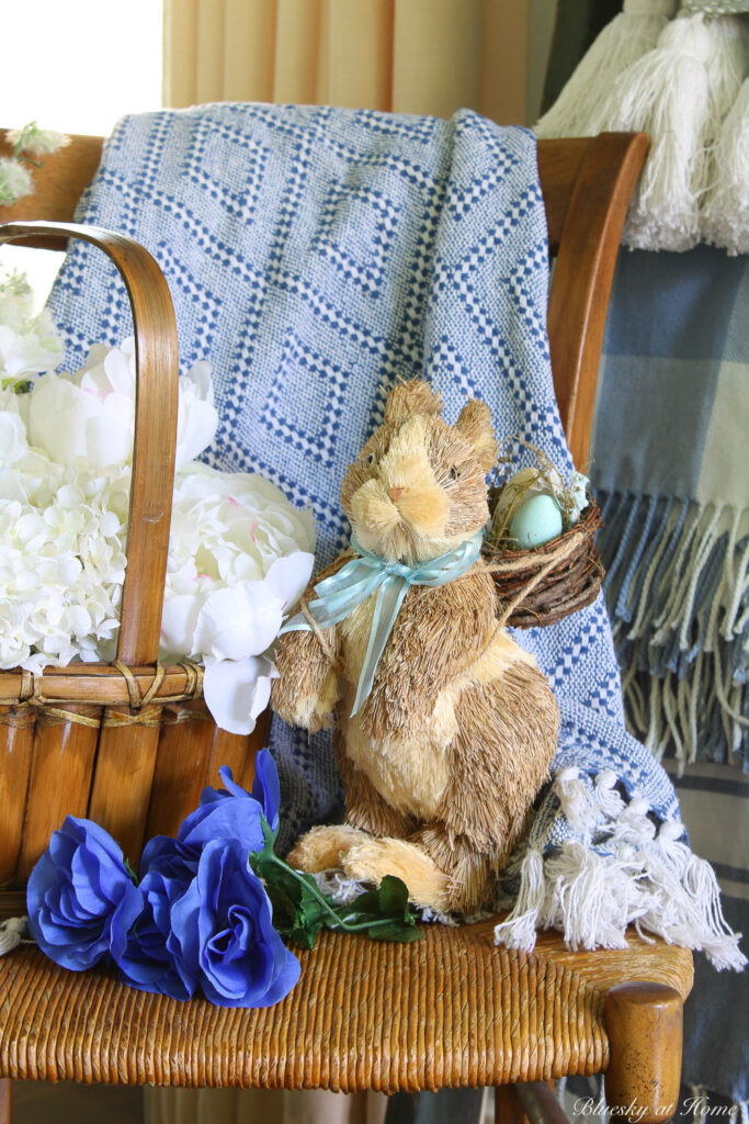 white flowers in basket with bunny