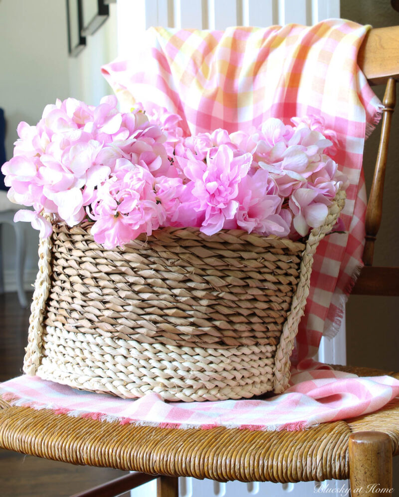  pink flowers in woven basket