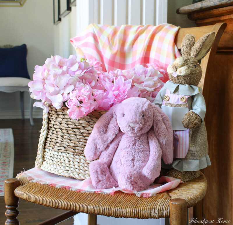 simple spring vignette with chair, flowers and bunny