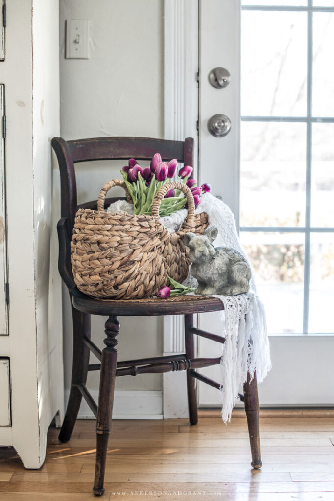 simple spring vignette with chair, flowers and bunny