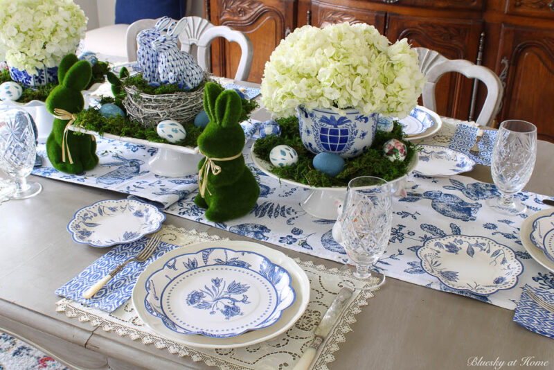 white hydrangeas with bunnies and blue in a spring tablescape