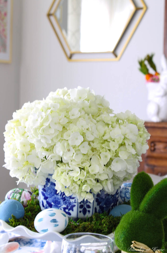 white hydrangeas in blue cache pot