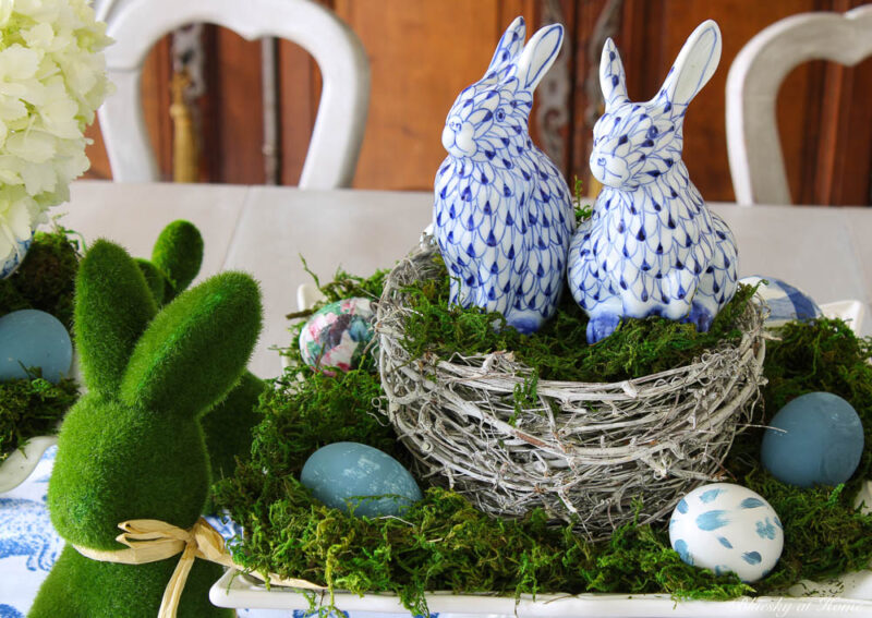 blue porcelain bunnies in bird's nest