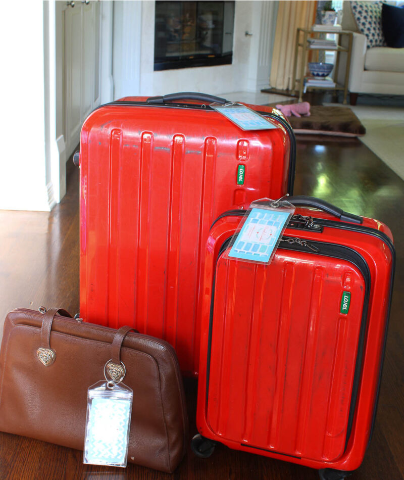 DIY luggage tag on red suitcases