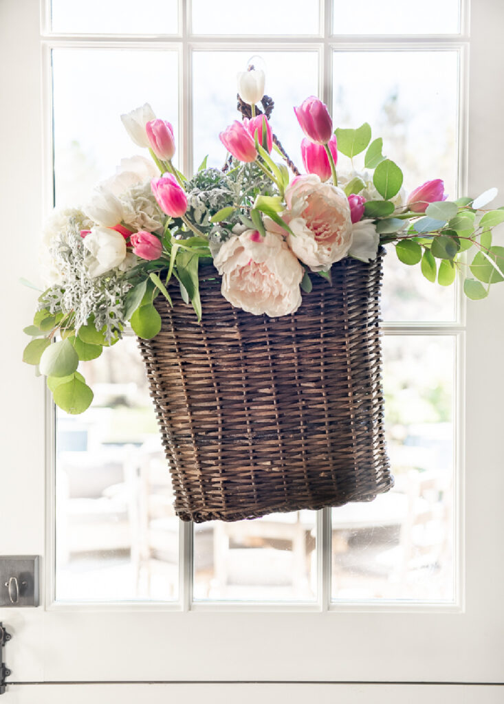 spring front door colorful flowers in basket