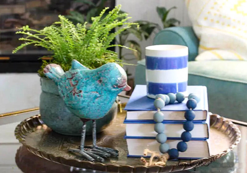 bird and candle on coffee table