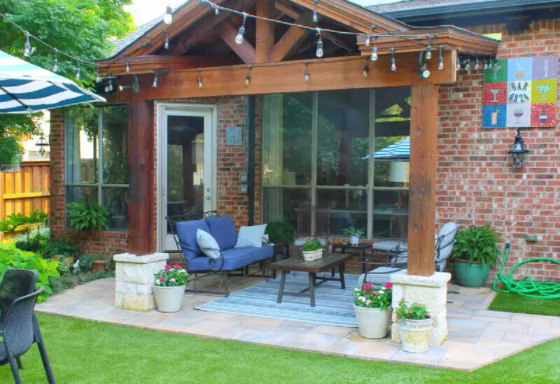 patio makeover with wood cover and stone patio