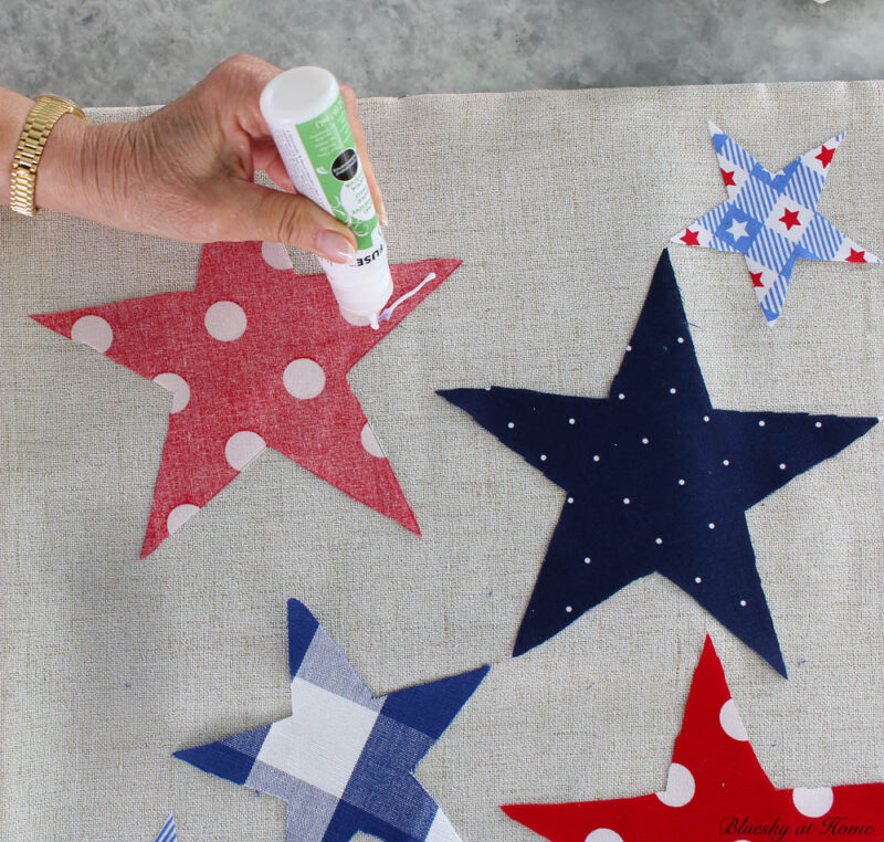 gluing stars to pillow cover