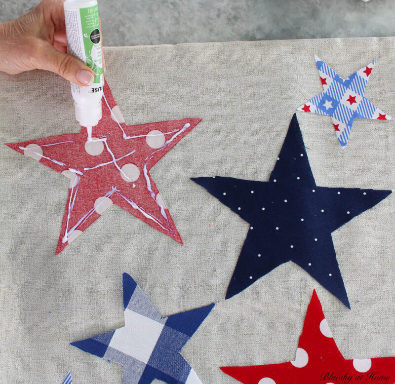 gluing stars to pillow cover