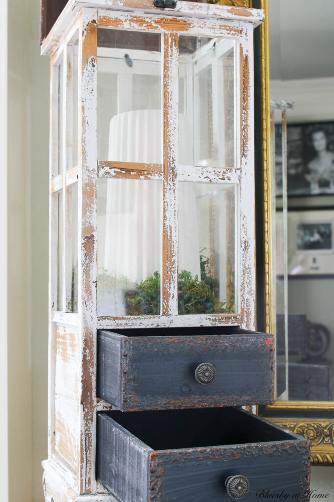 wood lantern and white vase