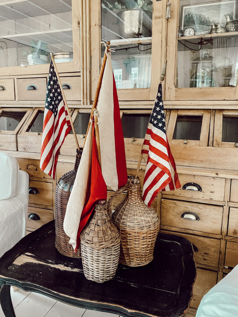 American flags in baskets on table