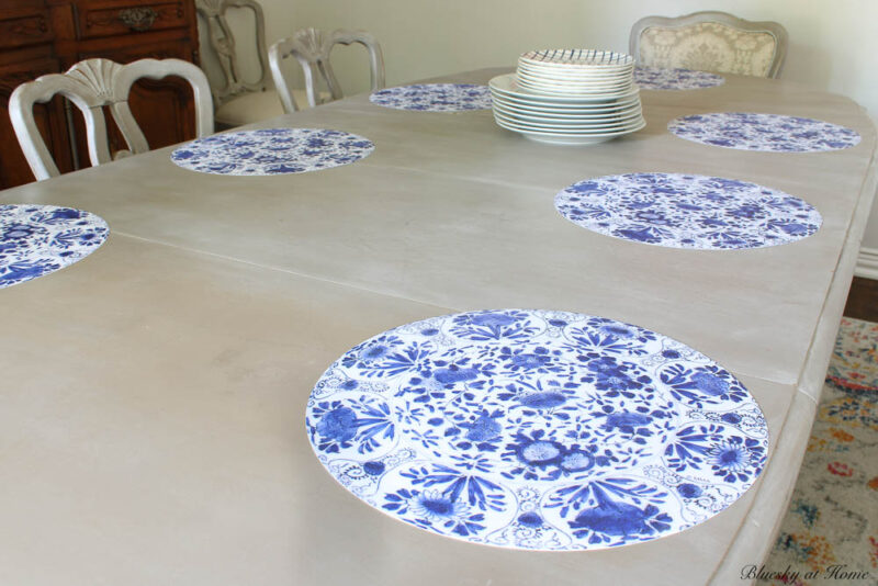blue and white placemats on the table