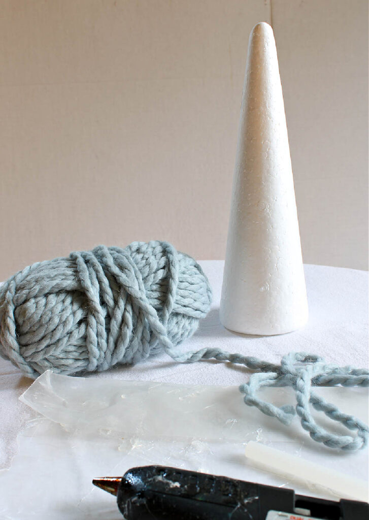 blue yarn and styrofoam cone