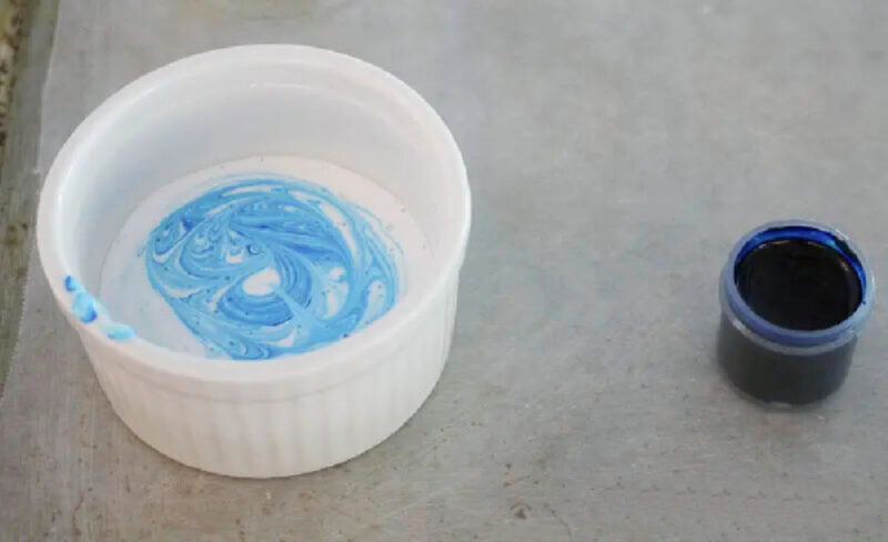 tinted blue glue in ramekin