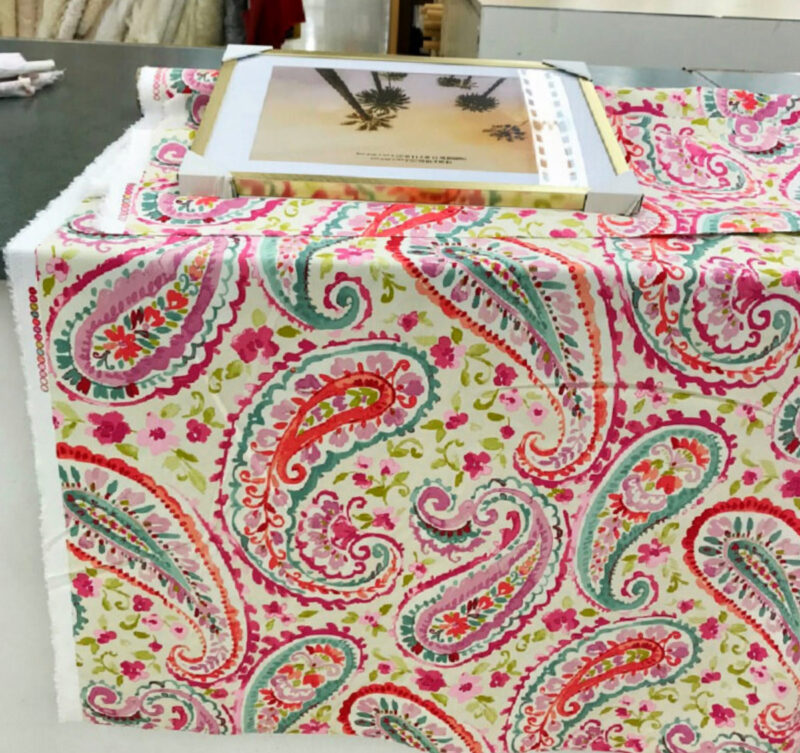 colorful abstract fabric on table with picture frame