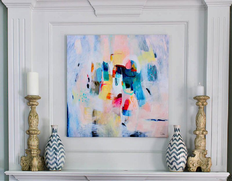modern abstract painting in bright colors on white mantel