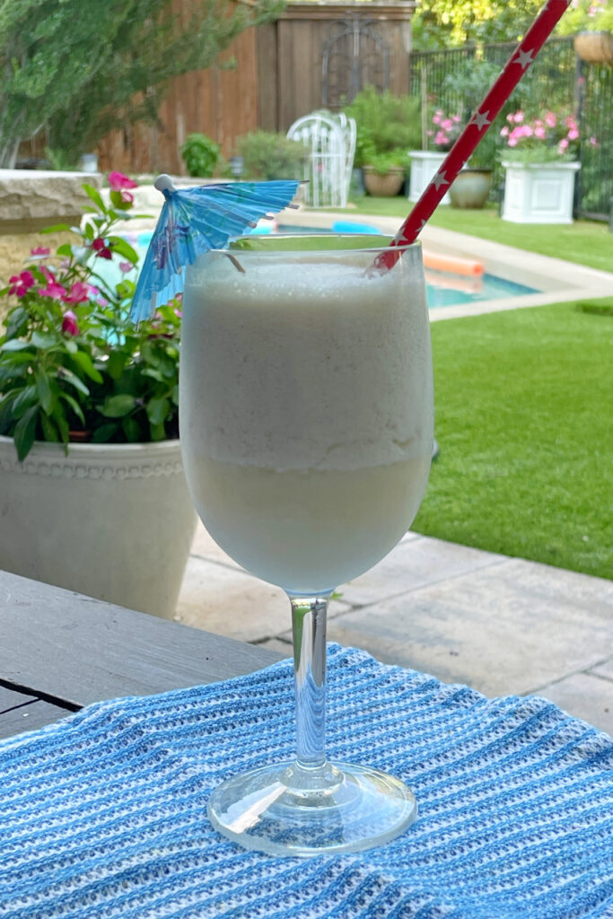 pina colada in a backyard with a pool in the background