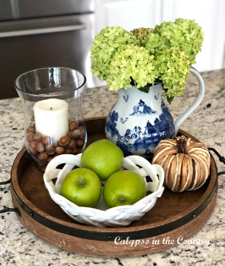 green apples and green hydrangeas with rustic pumpkin and acorns