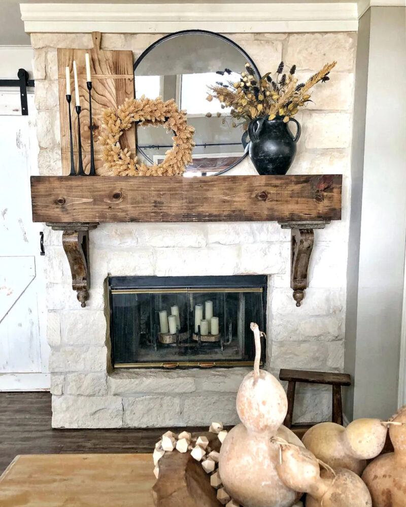 wood mantel with fall foliage wreath