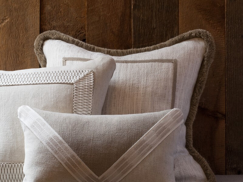 beige pillows with cream banding tape