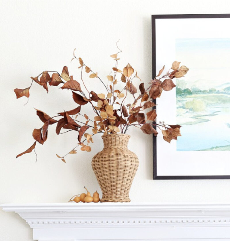 early fall decorating with florals in wicker vases on mantel