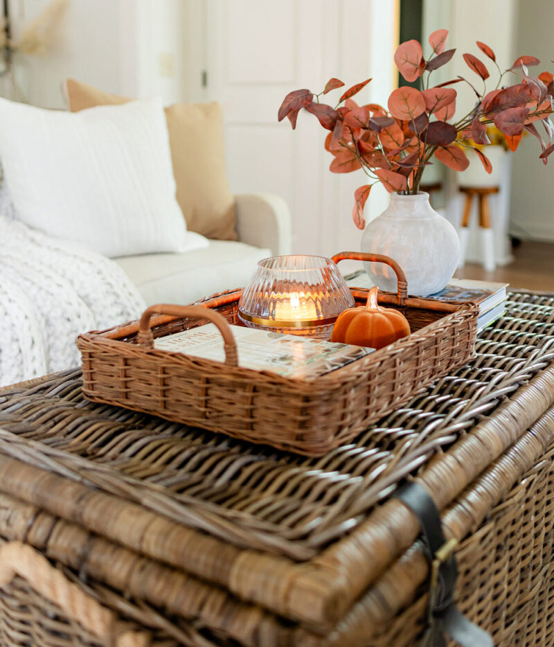 woven tray on wicker storage trunk for early fall decorating